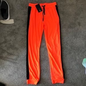 Fashion Nova Orange and Black Joggers